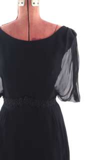 Beautiful late 1950s black cocktail dress. Dress is fully lined, the 