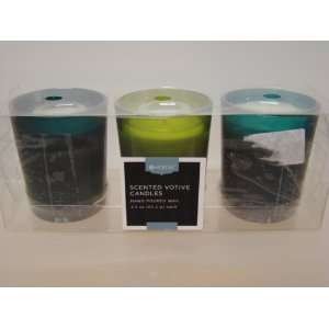   OF 3 SCENTED VOTIVE CANDLES IN GREEN VOTIVE HOLDERS 