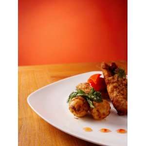  Fried Appetizers on Plate with Decorative Garnish 