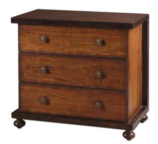 Cherry finished drawers tucked into a mahogany stained encasement 