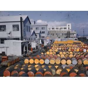  Workers Pile Drums of Oil Products in Emeryville 