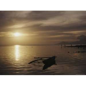  Outrigger Canoe Sitting in Quiet Surf in Tahiti with 