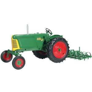   Tractor with Removable Side Shield and Spring Tooth Harrow Automotive