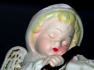 this auction is for a beautiful vintage girl snow baby angel playing 