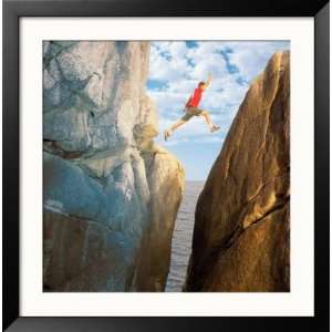  Man Jumping from Cliff to Cliff Collections Framed 