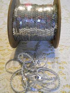   SILVER 5 MM SEQUINS ON A STRING   FROM THE 1980S   6 YARDS   MT25