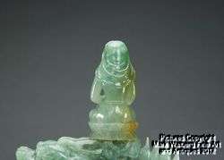 Pair of Chinese Jadeite Carvings of Guanyin on Qilin with Wooden 