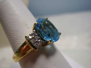 Beautiful Blue Topaz and Diamond Ring Done in 14K Yellow Gold  