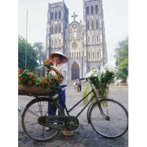 Woman Selling Flowers off Her Bicycle, Hanoi, Vietnam, Indochina, Asia 