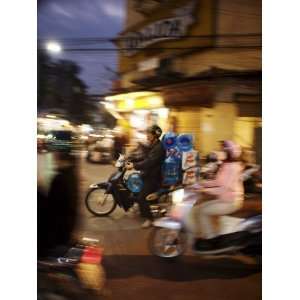  Motor Cyclist Carrying Water Bottles in Traffic, Vietnam 