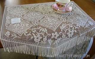 This exquisite Chantilly set of 4 fringed placemats are Ecru in color 