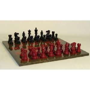   and Red Lacquered Chessmen on Grey Glossy Chess Board 